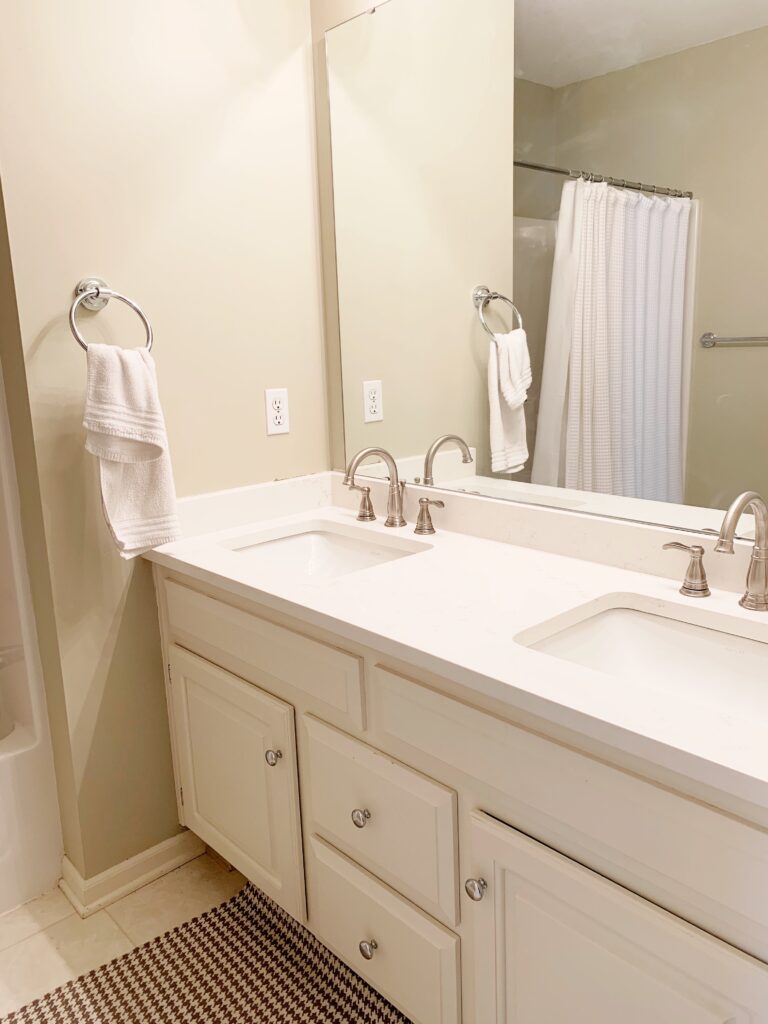 guest bathroom with new countertop shown during a renovation