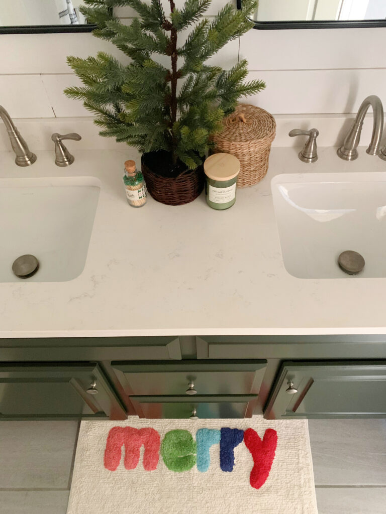 Merry bathmat in guest bathroom decorated for Chrismtas 