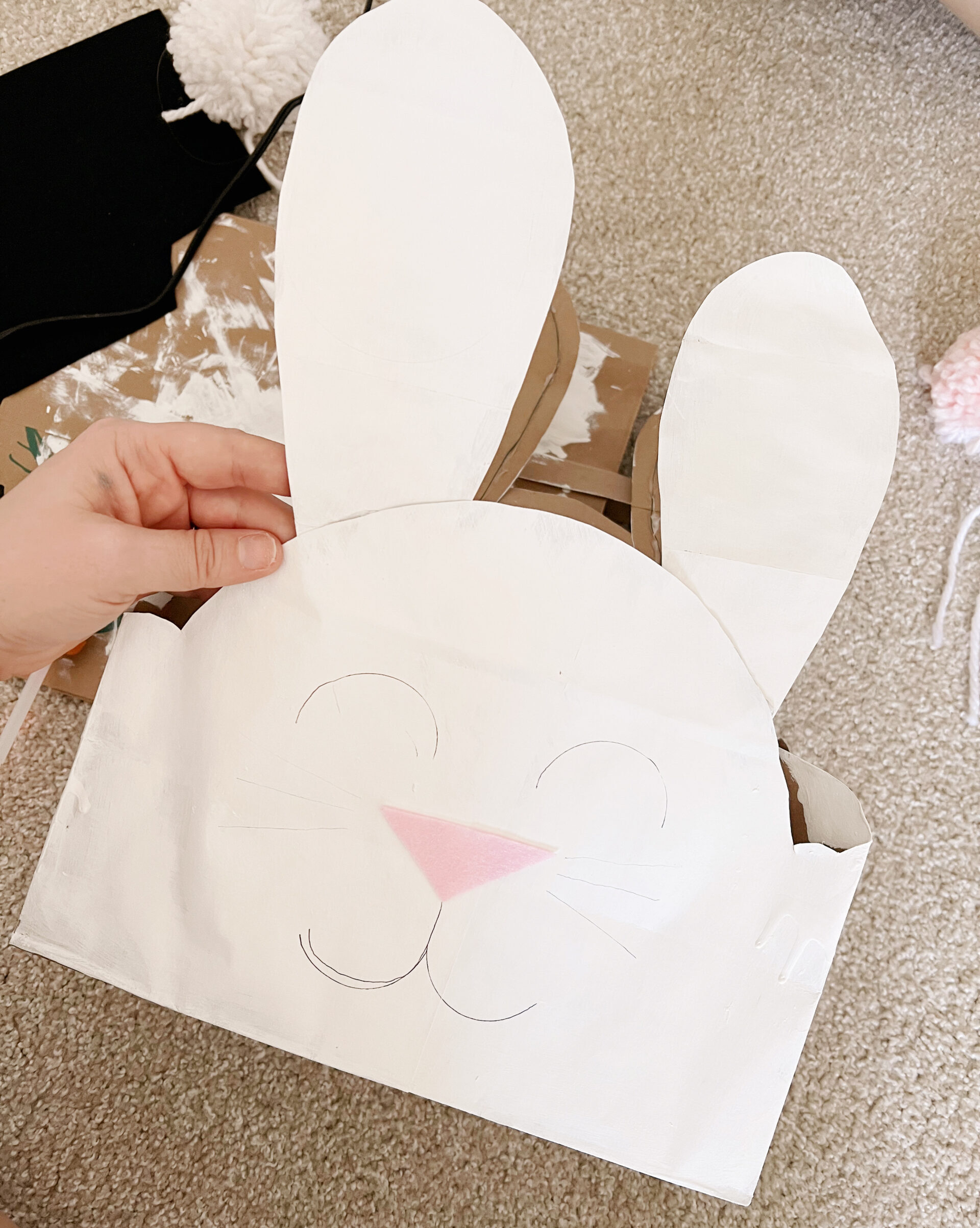 paper bag shaped into bunny face.