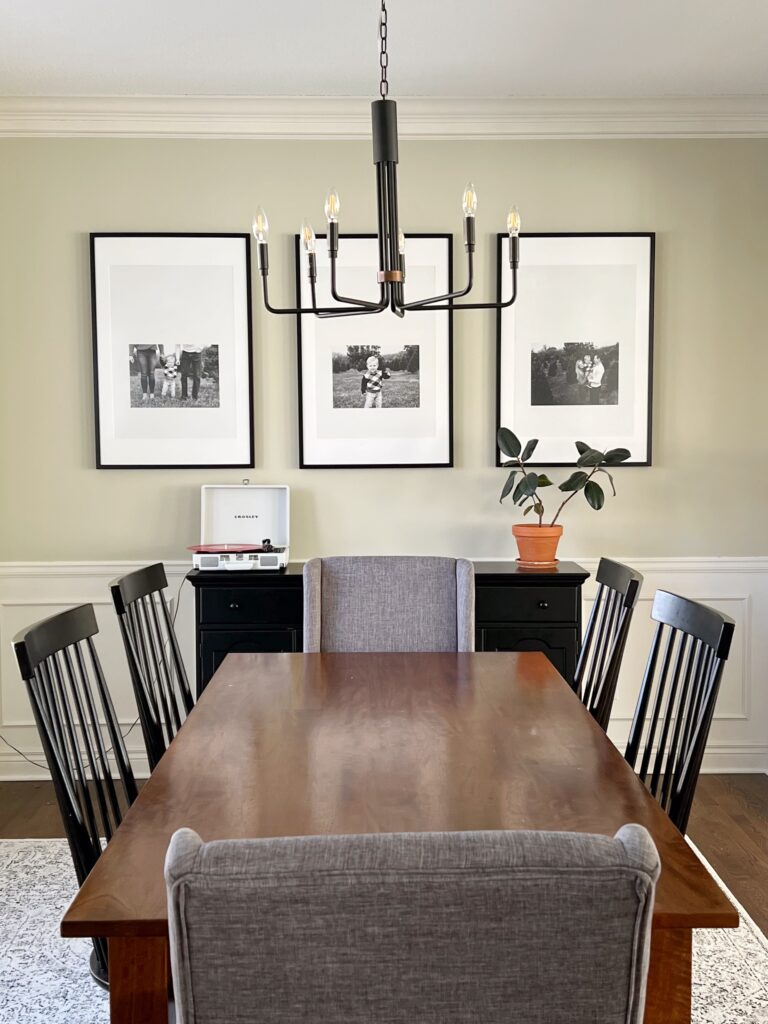 dining room with photos displayed on wall. 