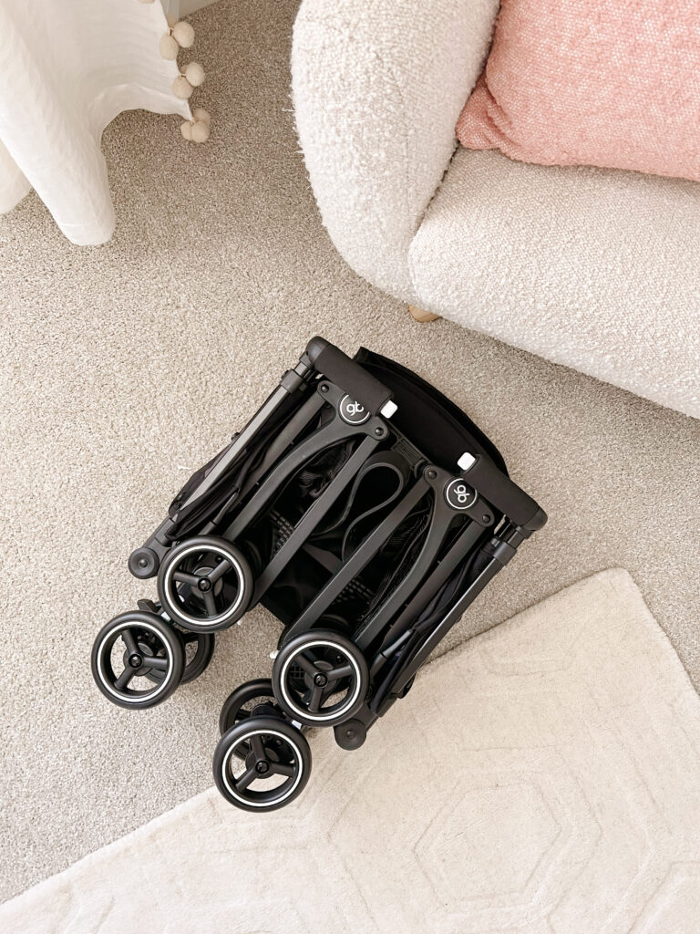 stroller folded into small, compact position. 