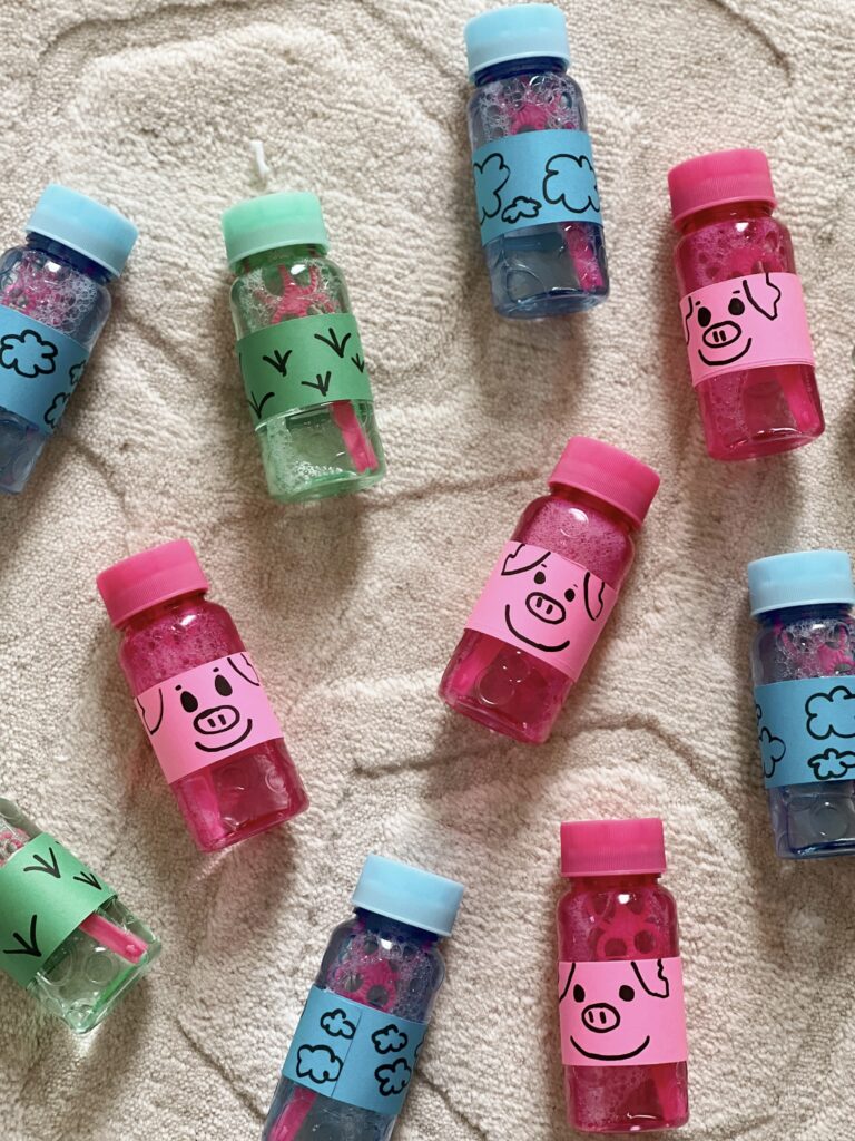 pink, blue and green bottles of bubbles. 