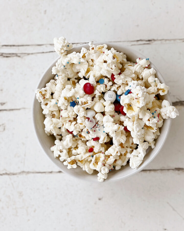 bowl of popcorn with red, white and blue candies in it.
