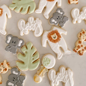sugar cookies decorated to look like jungle animals and plants.
