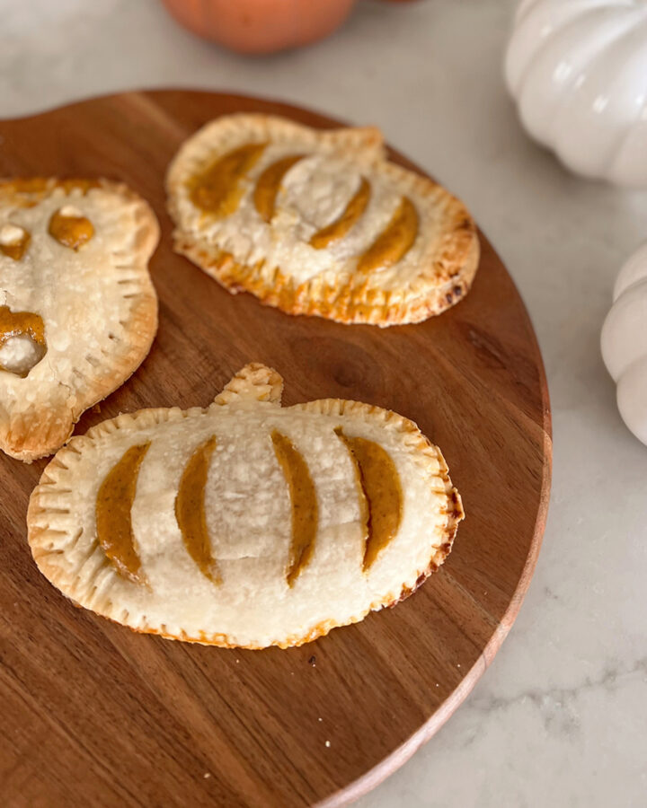 hand pies in shape of pumpkin on a serving tray.