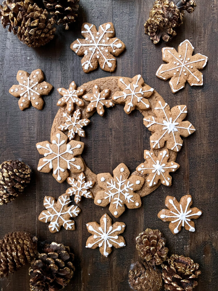 gingerbread cookie wreath decorated on a table. 