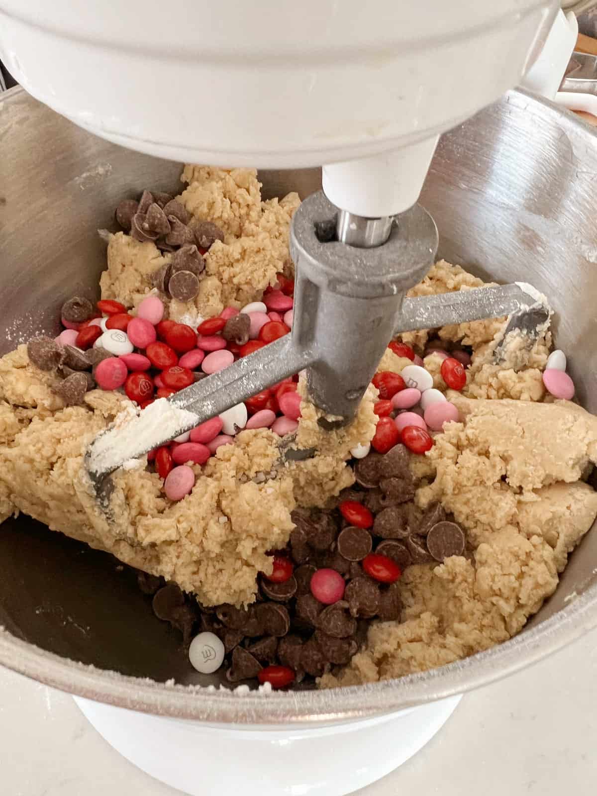 stand-mixer combining cookie dough.