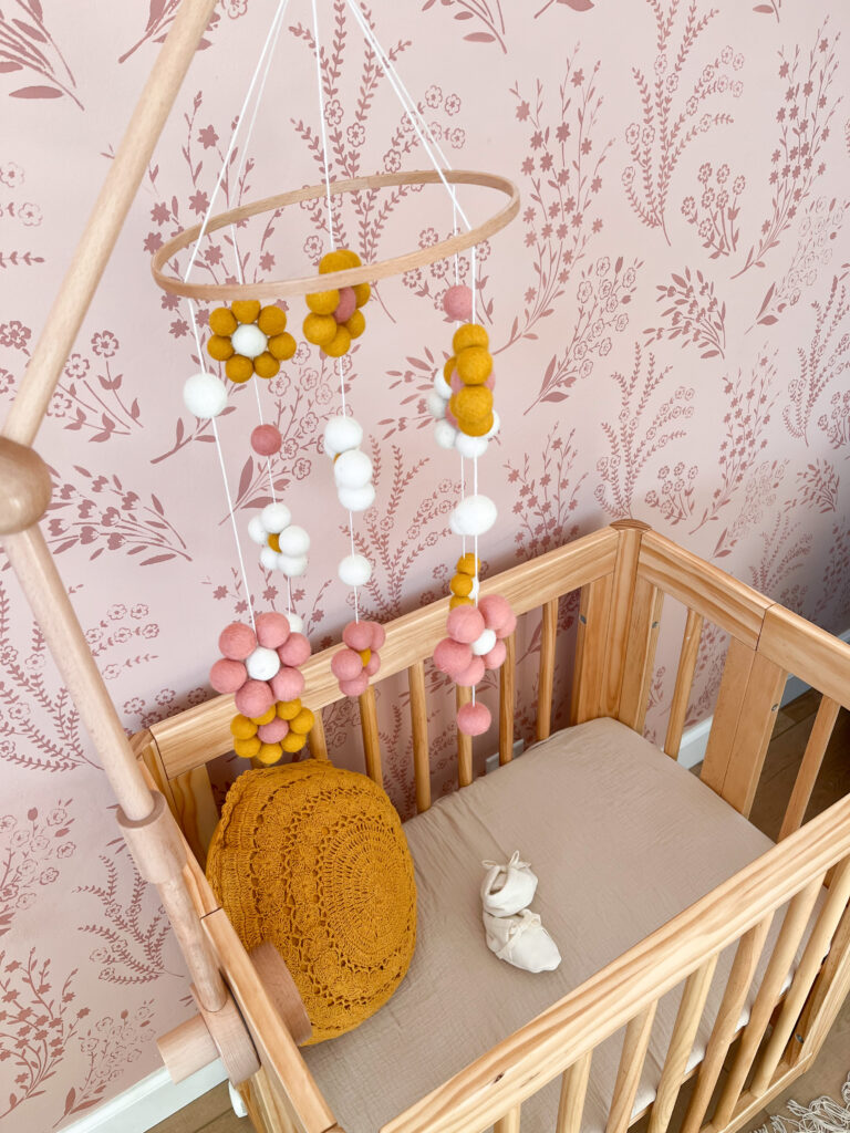 Baby mobile hanging over crib. 