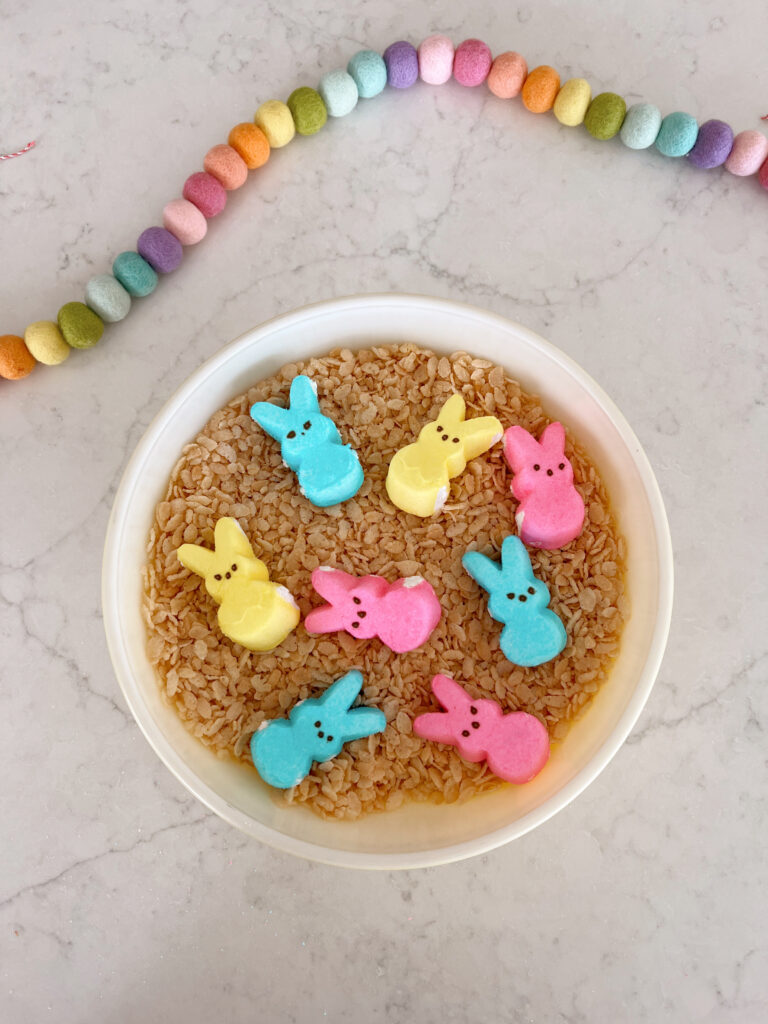 peeps in a large bowl of rice krispie cereal. 
