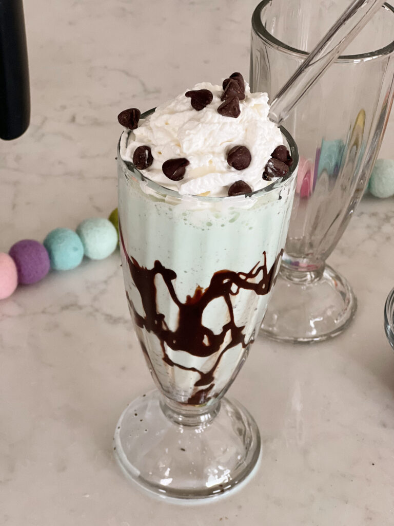 mint chocolatet chip shake in glass. 