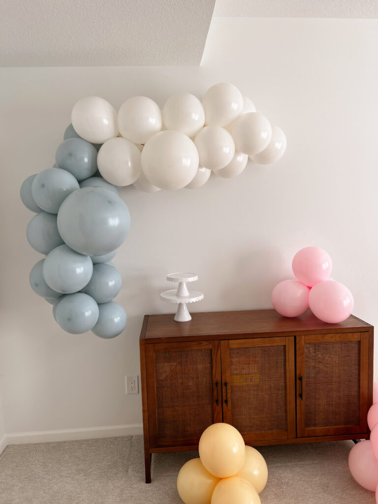 blue and white balloons forming a balloon garland. 