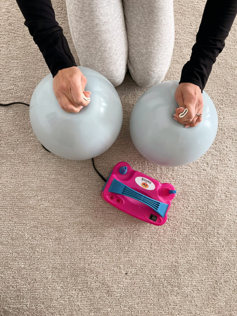 balloons being turned into a circle shape. 