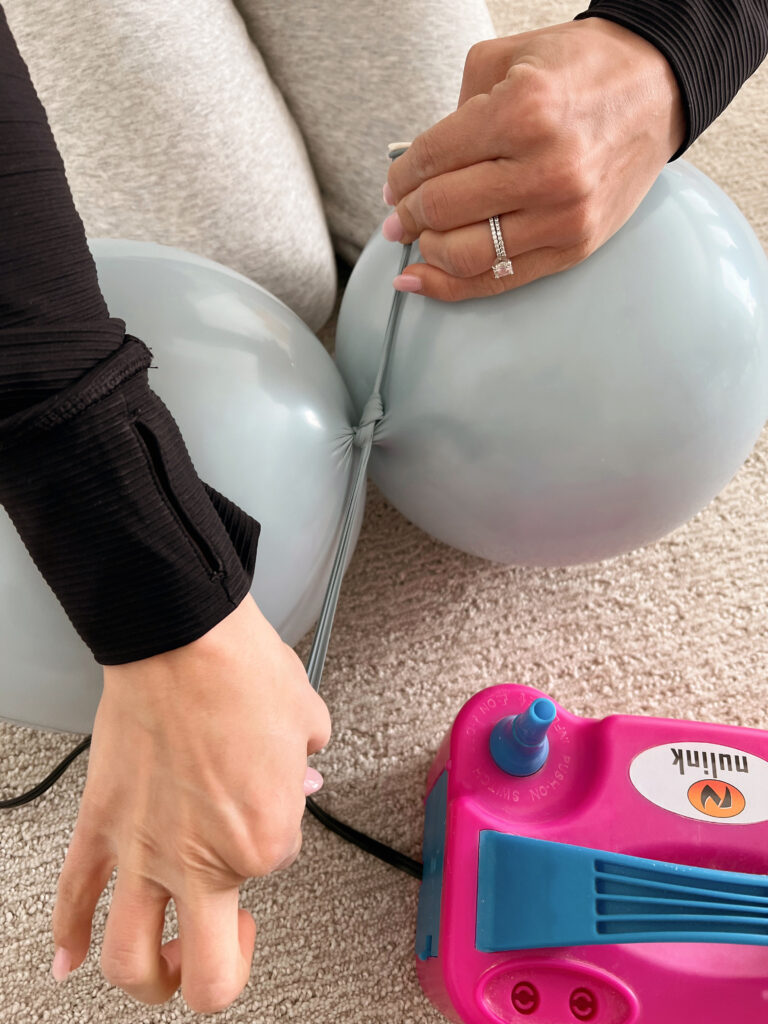 balloons being tied together. 